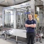 Ben Hirsch close up with bottling line